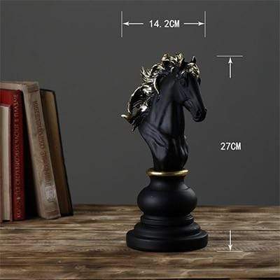 Black decorative chess knight on wooden table