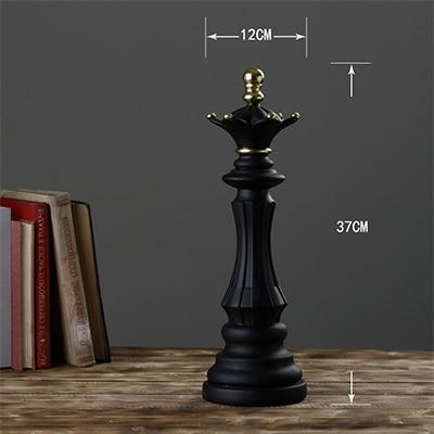 Black decorative chess king on wooden table