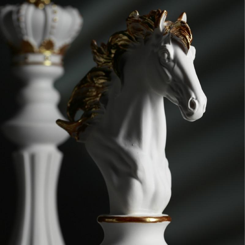 White decorative chess queen and knight