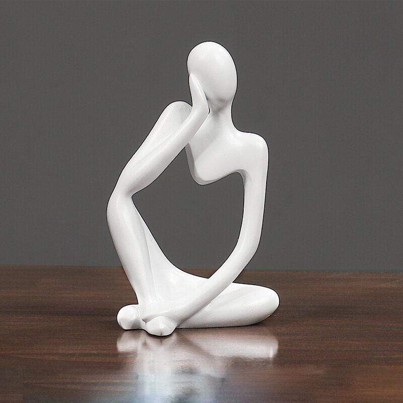 White Thinking sculpture decor on a table