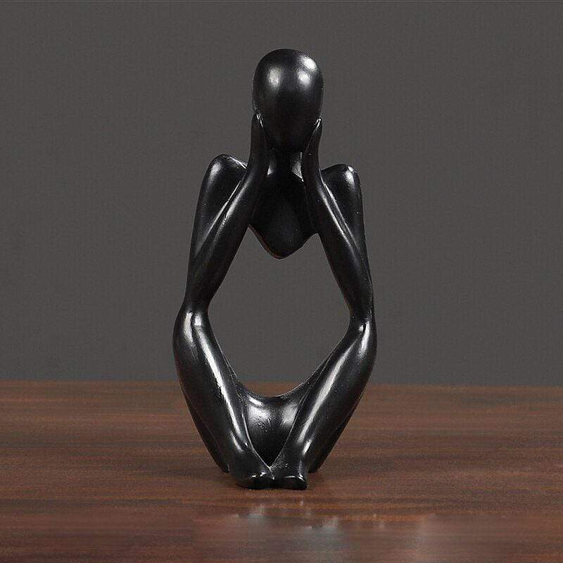 Black Thinking sculpture decor on a table