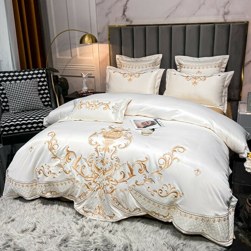 https://lezzedesign.com/cdn/shop/products/white-and-gold-embroidered-bedding-set_3.jpg?v=1640886432&width=800